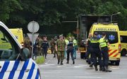 Hulpdiensten bij een militair oefenterrein in Ossendrecht. Veertien leerlingen zijn gewond geraakt door een blikseminslag. beeld ANP