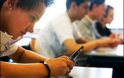 Nederland loopt nog niet warm voor een verbod op telefoongebruik op middelbare scholen. beeld ANP, Robin Utrecht