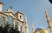 Een kerk (l.) en een moskee in de Libanese hoofdstad Berut. beeld Flickr