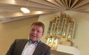 Ide Boogaard in 2013 bij het orgel dat hij bouwde voor de gereformeerde gemeente in Scherpenzeel. beeld RD, Anton Dommerholt