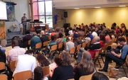 Een bijeenkomst bij de ICF-gemeente in Apeldoorn. beeld Arie Maasland