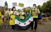 Syriërs protesteren in Den Haag tegen de inzet van biologische en chemische wapens door de Syrische president Assad. beeld