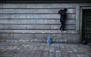 De aanslagen in Brussel waren eigenlijk gepland voor Pasen, maar werden vervroegd wegens de arrestatie van Salah Abdeslam. Intussen is op een muur in Brussel de paasboodschap te lezen: Jezus redt, Koning van vrede. beeld AFP