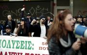 „Een zorgelijk punt is de Griekse werkloosheid.” Foto: demonstranten vrijdag 7 december bij het ministerie van Arbeid in de Griekse hoofdstad Athene.  beeld EPA