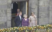 „Een van de spannendste momenten was het ogenblik waarop, na de abdicatie, de deuren opengingen en Beatrix met de nieuwe koning en koningin het balkon betrad.”  Foto ANP