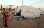 Christenen in een vluchtelingenkamp in het noorden van Irak. Beeld EPA