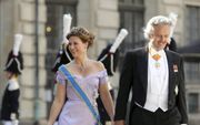 De Noorse prinses Märtha Louise en Ari Behn wonen juni 2013 in Stockholm het huwelijk bij van de Zweedse prinses Madeleine en Chris O’Neill beeld EPA