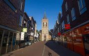 Winkelstraat en Oude Kerk in Ede. beeld ANP