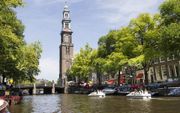 De toren van de Westerkerk in Amsterdam komt uit een overgangsfase, maar heeft duidelijk in het bovenste gedeelte klassieke invloeden, bijvoorbeeld door de Dorische, Ionische en Korintische hoelzuilen.  beeld RD, Anton Dommerholt