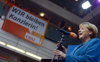 Merkel na haar overwinning. Beeld EPA