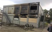Door een brand gingen in de nacht van vrijdag op zaterdag 30 juli acht noodlokalen van het Hoornbeeck College in Rotterdam verloren. Later bleek dat de brand ontstaan is in combinatie met een inbraak.  beeld ANP