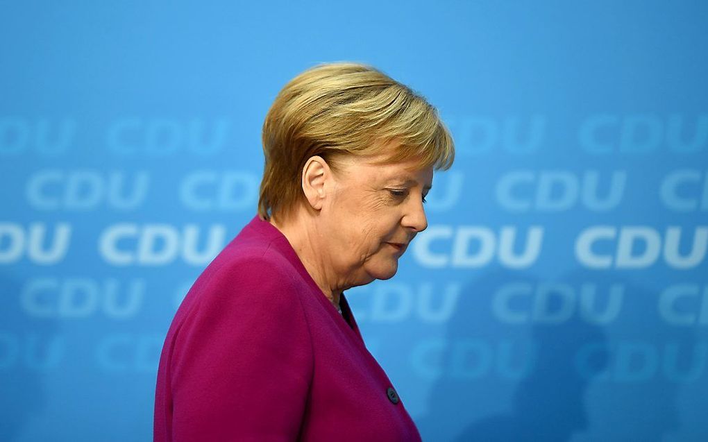 Merkel tijdens een persconferentie, maandagmiddag. beeld EPA