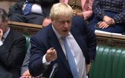 De Britse premier Boris Johnson, 3 oktober in het Britse parlement. beeld AFP