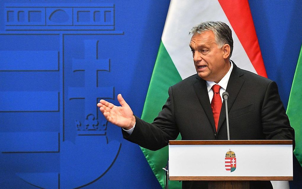 De Hongaarse premier Viktor Orban maandag tijdens een persconferentie in Boedapest. beeld AFP, Attila Kisbenedek