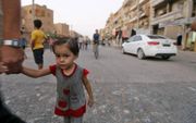 Syrisch kind in oorlogsgebied.  beeld AFP, Louai Beshara