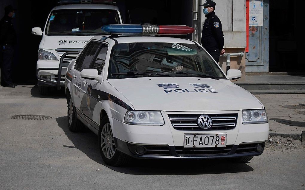 Een Chinese politiewagen. beeld AFP, Noel Celis