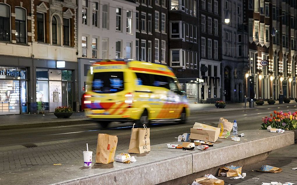 Het Damrak in Amsterdam. beeld ANP RAMON VAN FLYMEN