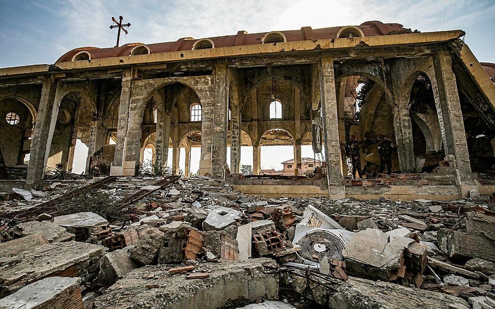 „Schenkt God, naast het geloof, het lijden als een bijzondere genadegave?” Foto: door IS verwoeste kerk in Syrië. beeld AFP, Delil Souleiman