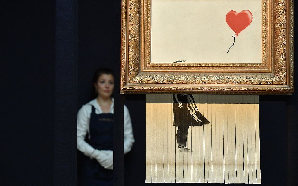 Het deels versnipperde kunstwerk Love is in the Bin. beeld AFP, Ben Stansall