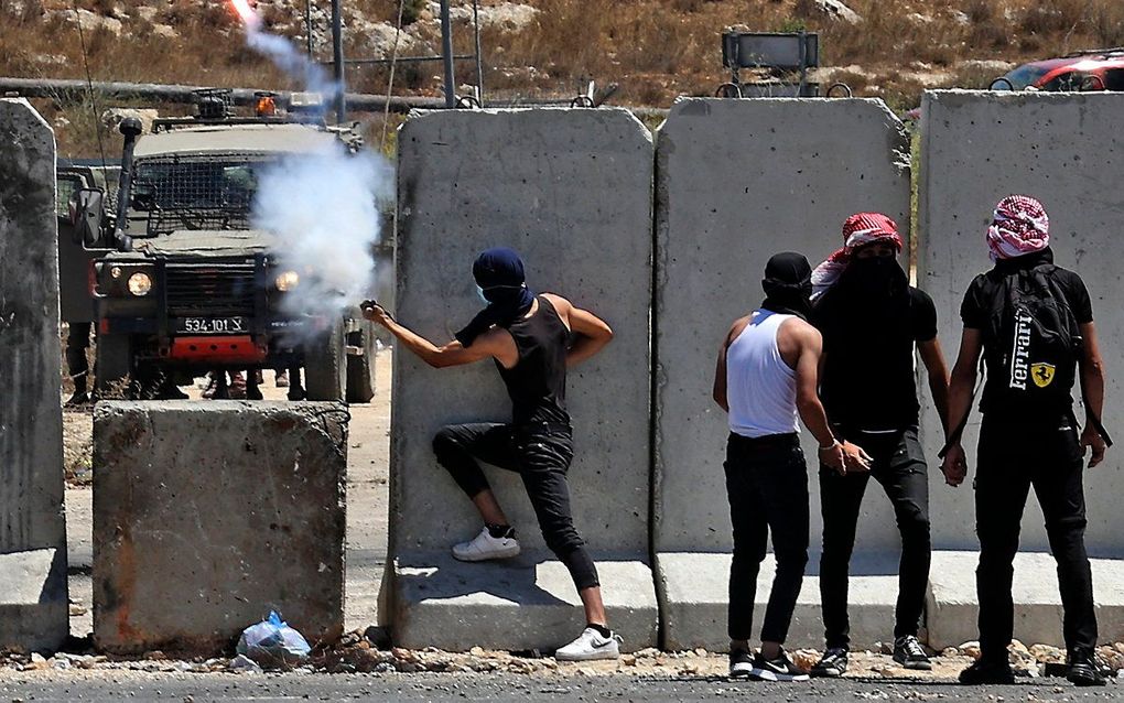 Protest tegen een Israëlische nederzetting op de Westelijke Jordaanoever. beeld AFP, Abbas Momani