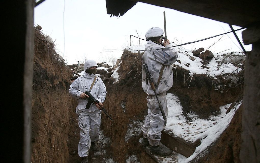 Oekraïense soldaten in de buurt van het dorp Verkhnetoretskoye, in de regio Donetsk. beeld AFP, Anatolii Stepanov