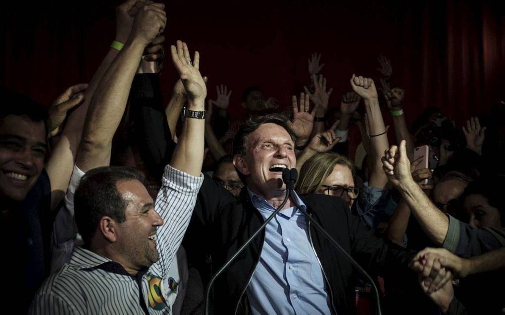 De nieuwe burgemeester van de Braziliaanse stad Rio de Janeiro, Marcelo Crivella, was ooit zendeling in Afrika en is in zijn land vooral bekend als gospelzanger. beeld AFP, Yasuyoshi Chiba