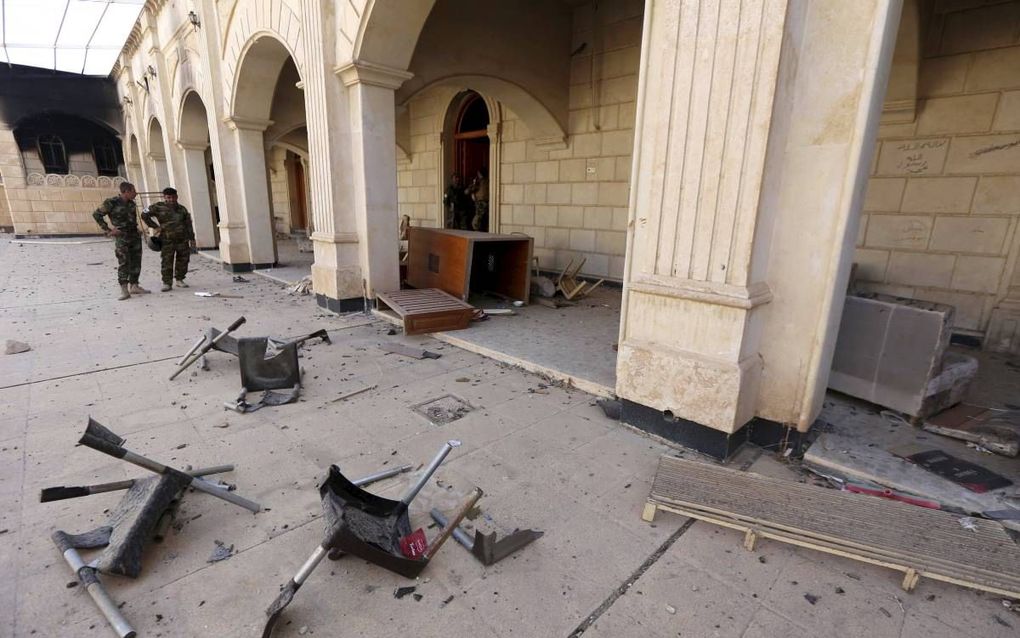 Een verwoeste kerk in Qaraqosh. beeld AFP, Safin Hamed