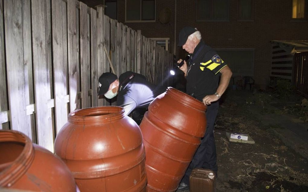 Een Arnhemse woning waar de politie binnenviel in verband met de arrestaties van terreurverdachten.  beeld ANP, Piroschka van de Wouw