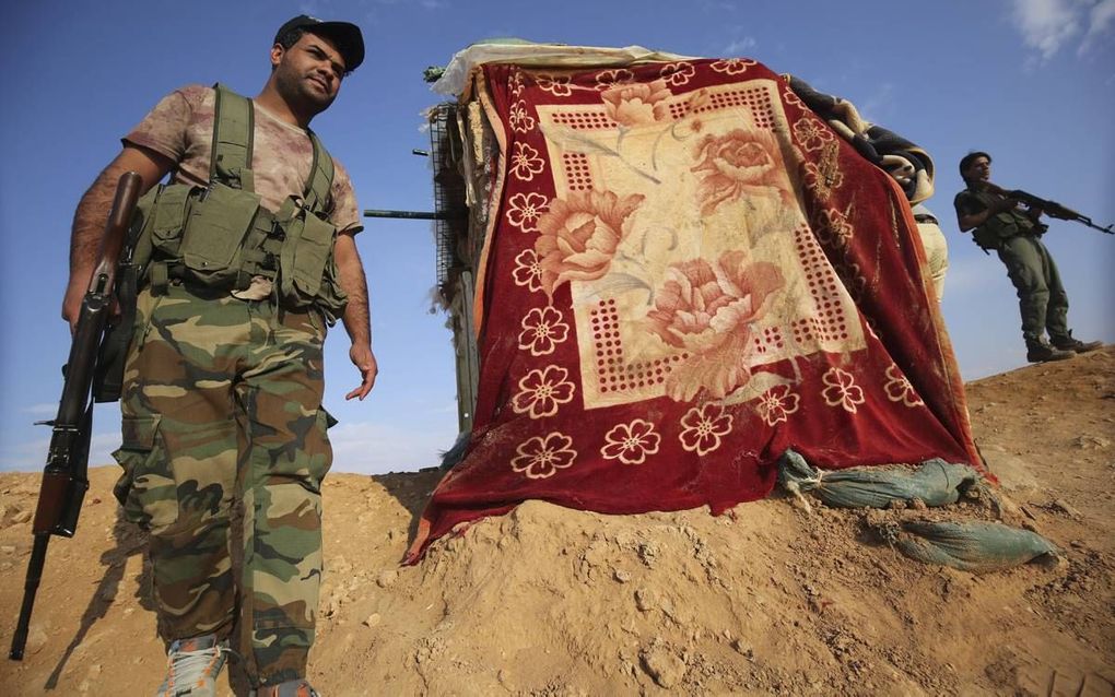 Iraakse milities houden IS in de gaten. beeld AFP, Ahmad al-Rubaye