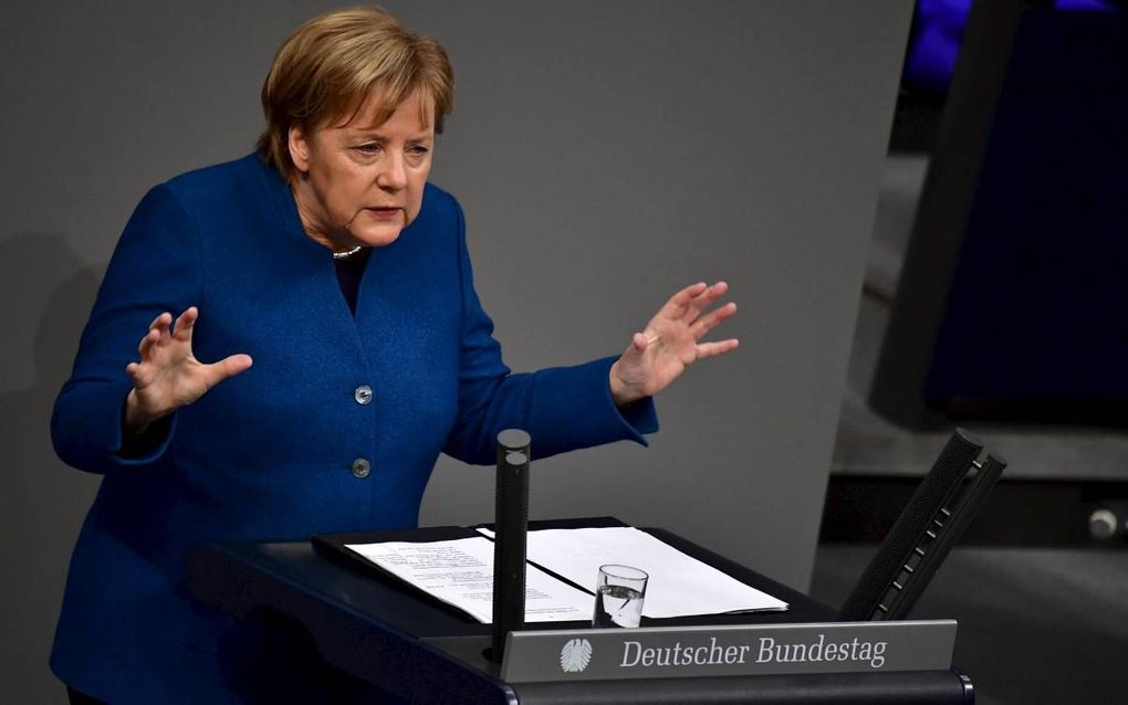 „Meer dan ooit worden van Duitsland wijsheid en evenwichtigheid verwacht. Daarom moet Angela Merkel aan het roer van haar land blijven staan.” beeld AFP, Tobias Schwarz