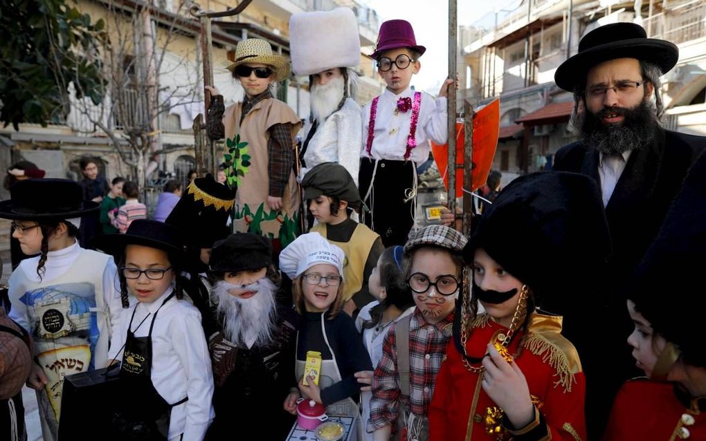 Purim is een uitbundig volksfeest. beeld AFP, Menahem Kahana