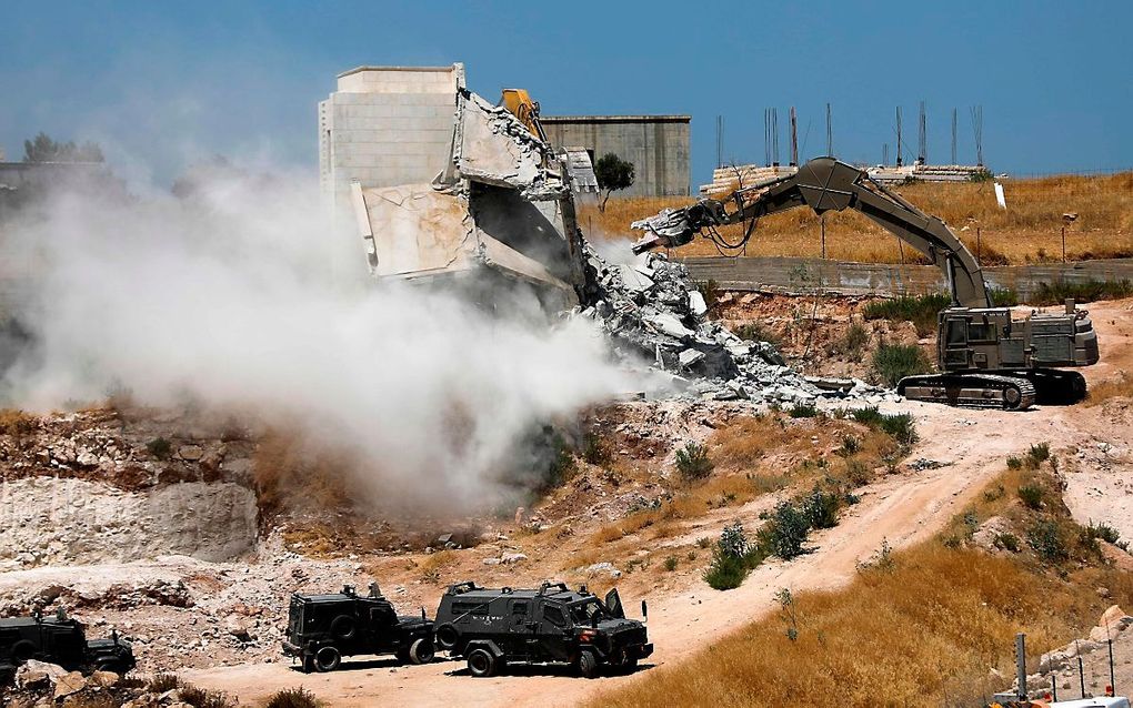 Israël heeft maandag gebouwen gesloopt in Wadi al-Hummus in de Palestijnse wijk Sur Baher in Oost-Jeruzalem. De flats lagen gedeeltelijk in gebieden die de Palestijnse Autoriteit bestuurt. beeld AFP