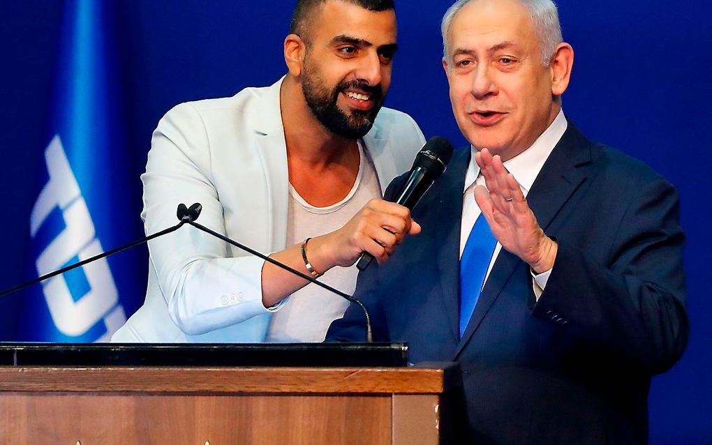 „Wat een vreugdevolle nacht”, sprak een stralende Netanyahu een juichende menigte toe in Tel Aviv. Zijn Likud-partij komt uit op 36 of 37 zetels. „Deze overwinning is bijzonder zoet, want het is een overwinning tegen alle verwachtingen in.” beeld AFP