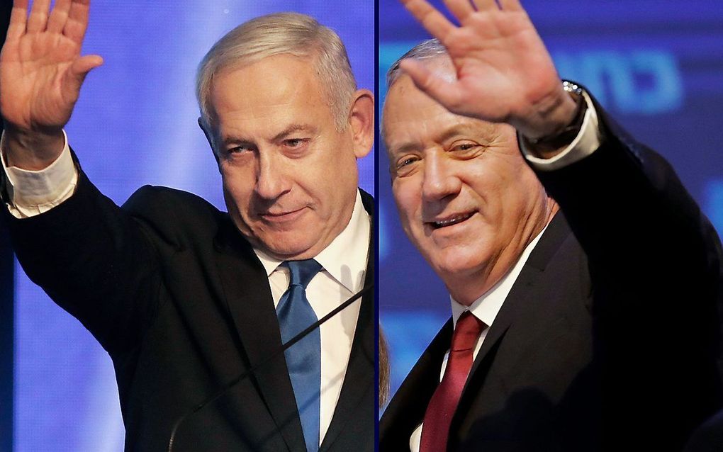 Benjamin Netanyahu (L) en zijn voormalige rivaal Benny Gantz. beeld AFP