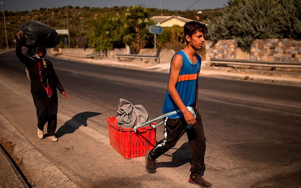 Migranten op Lesbos. beeld AFP, Angelos Tzortzinis