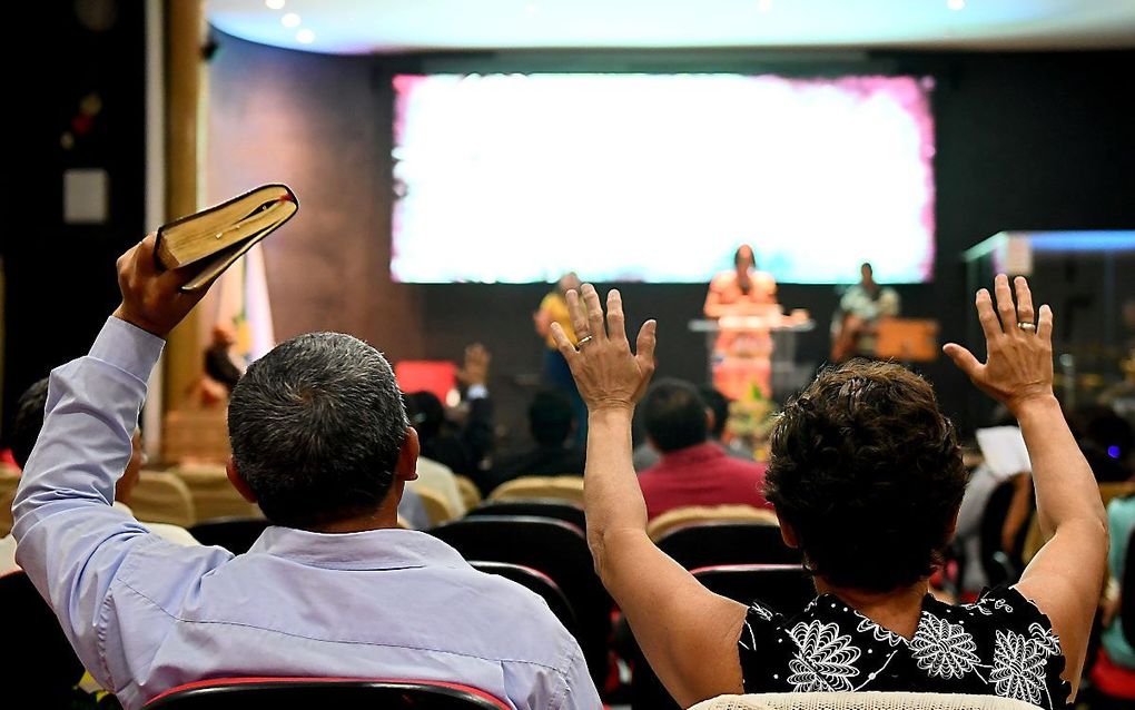 Bijeenkomst in een evangelische kerk in Brasilia. beeld AFP, Evaristo SA