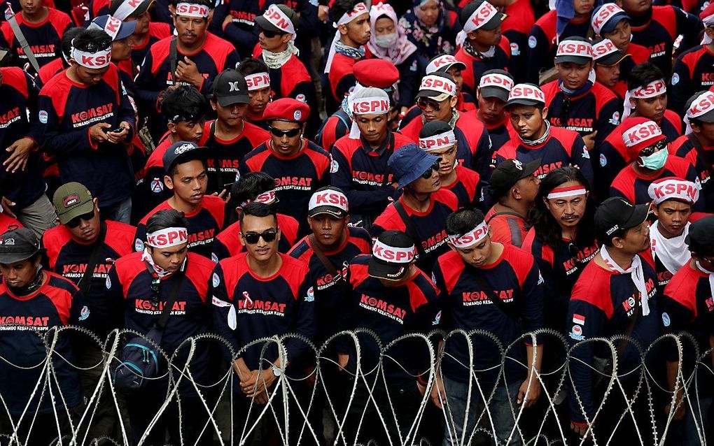 Arbeiders protesteren in mei voor een beter loon in de Indonesische hoofdstad Jakarta. beeld EPA, Bagus Indahono