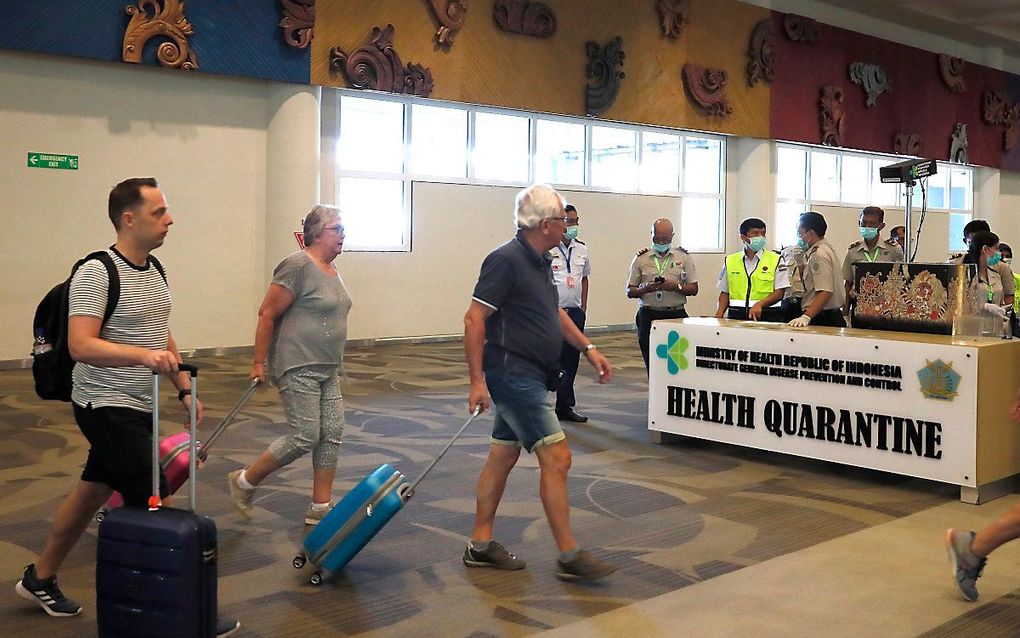 Passagiers op Ngurah Rai International Airport in Kuta, op het Indonesische eiland Bali. beeld EPA