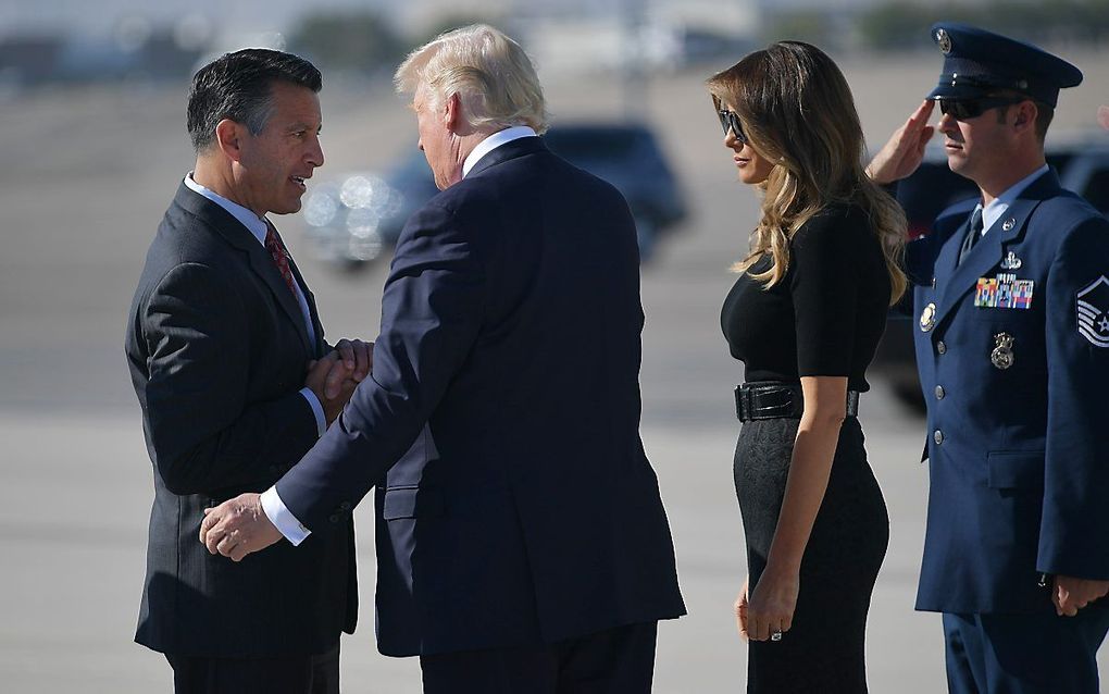 Trump en zijn vrouw komen aan in Las Vegas. beeld AFP