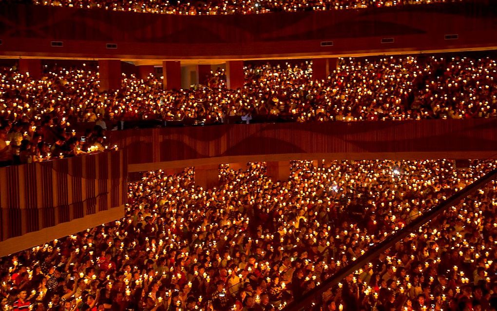 Massale kerstviering van christenen in Indonesie, in een stadion in Surabaya. beeld AFP