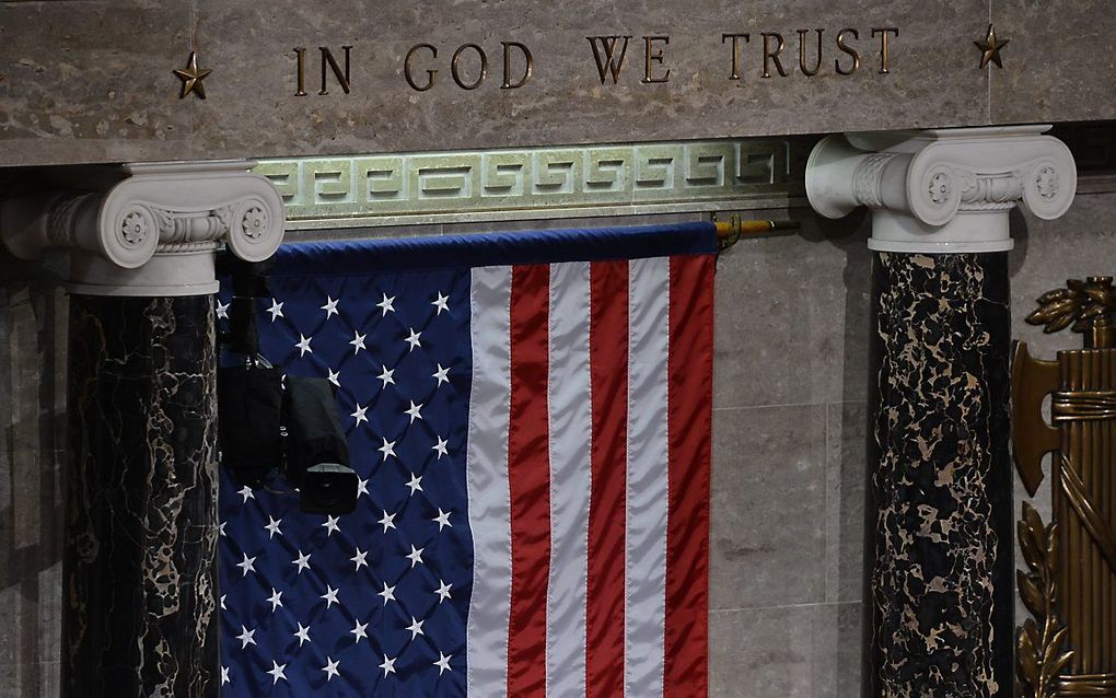 Het motto ”In God We Trust" in het Amerikaanse Huis van Afgevaardigden. beeld AFP, Jewel Samad