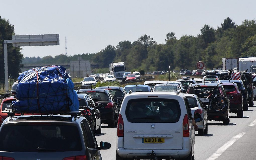 Lange files op Zwarte Zaterdag, 3 augustus, in Frankrijk. beeld AFP, Mehdi Fedouach