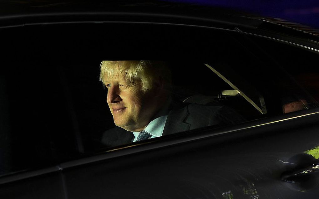 Johnson verlaat het Lagerhuis na stemmingen op woensdagavond. beeld AFP