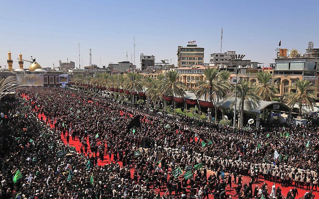 Een rouwprocessie in Karbala, Irak. beeld AFP