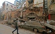 Verwoesting in een wijk van Beiroet. beeld AFP