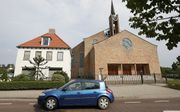 Het kerkelijk bureau van de Gereformeerde Gemeenten in Nederland te Opheusden (l.). beeld VidiPhoto