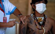 Deze Guaraní krijgen het vaccin van Sinovac Biotech, een Chinees biofarmaceutisch bedrijf. beeld AFP, Mauro Pimentel