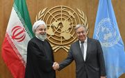 De Iraanse president Hassan Rouhani met de secretaris-generaal van de VN, Antonio Guterres (september 2019). beeld AFP, Angela Weiss