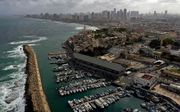 De Israëlische kustplaats Jaffa. Op de achtergrond Tel Aviv. beeld AFP, Menahem Kahana