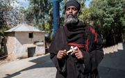 Een orthodoxe priester in buurland Ethiopië. De Eritrees-Orthodoxe Kerk ontstond toen Eritrea in 1993 onafhankelijk werd van Ethiopië. beeld AFP, Eduardo Soteras